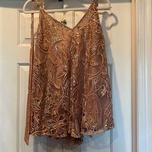 Size XS Free people Swingin It Romper. Rose gold color/pink